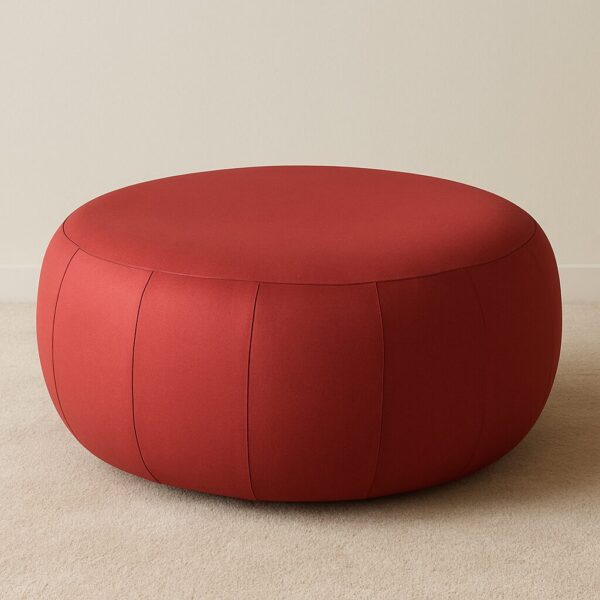 DISH upholstered pouf ottoman in red fabric with rounded dish-inspired silhouette for lounge spaces