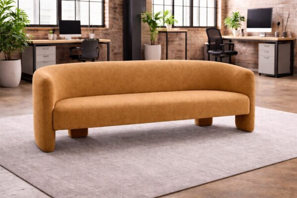 NUVIA contemporary reception sofa in camel fabric finish featuring a sculptural curved design in a professional office setting.