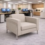 Venus single seater sofa in cream fabric featuring stainless steel accents and minimalist styling.
