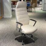Viola High Back executive chair in premium grey upholstery displayed in a modern office environment.