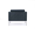 Rear view of Monza lounge chair showcasing clean upholstered back panel.