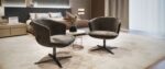 RIRI dark brown swivel lounge chairs in a contemporary bedroom seating area